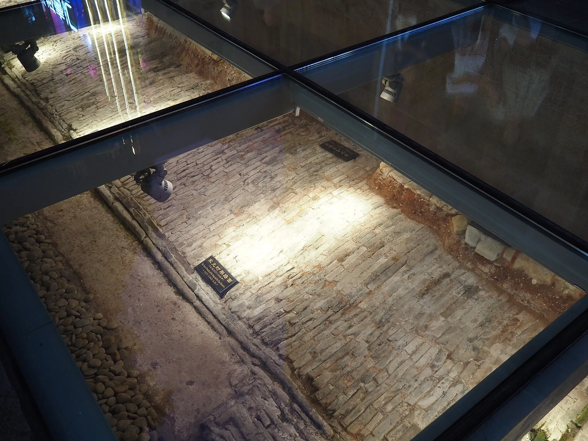 Song-dynasty road surface preserved under glass at the Beijing Road ancient road site