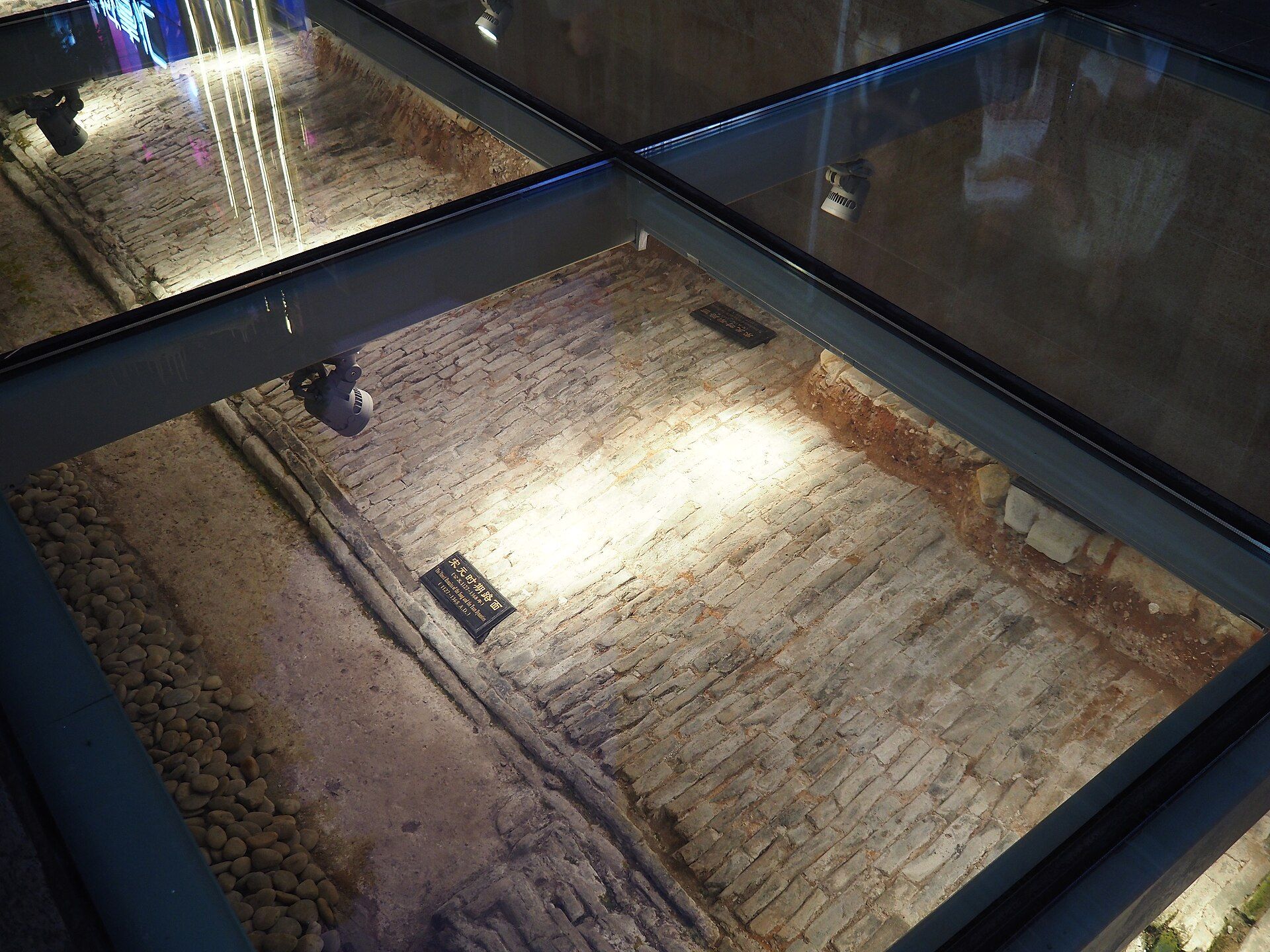 Song-dynasty road surface preserved under glass at the Beijing Road ancient road site
