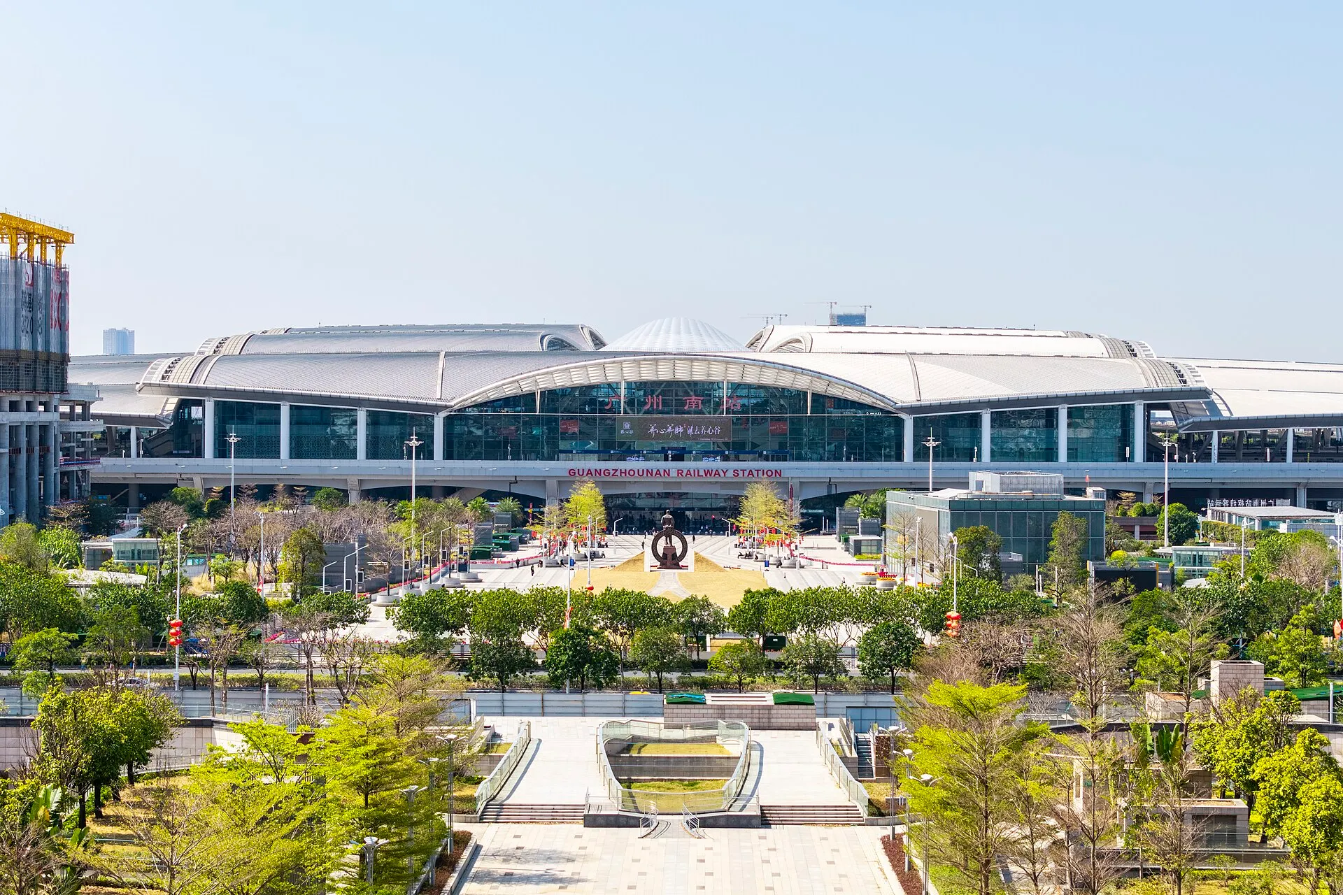Front of Guangzhou South Railway Station seen from an elevated point, with the station name sign above the plaza