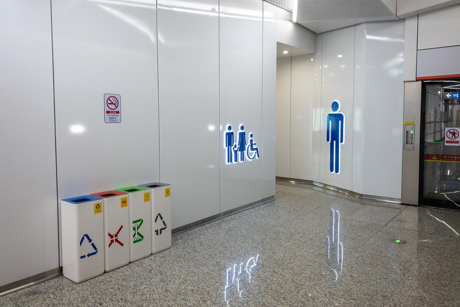 Toilet entrance with family, accessible and men's signs at the Line 22 platform level, Guangzhou South Railway Station
