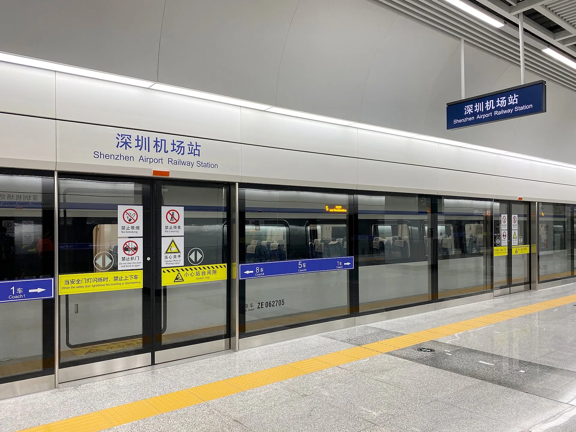 Platform of Shenzhen Airport Railway Station with the station sign