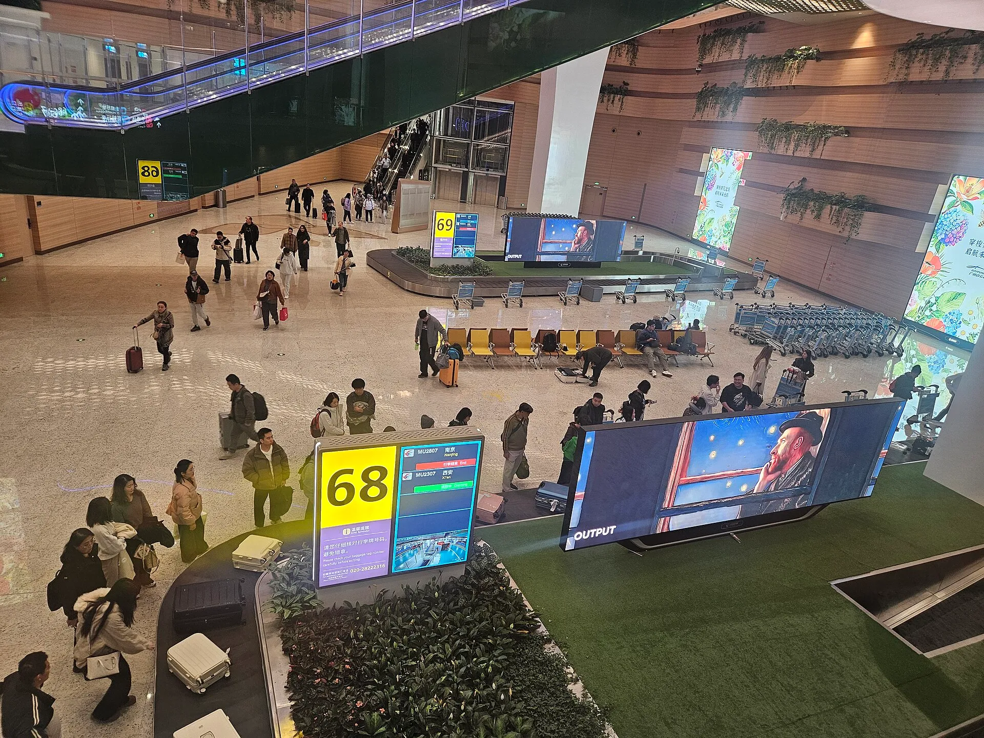 Baggage claim hall in Terminal 3, Guangzhou Baiyun Airport, a port of entry where printed copies are handed out