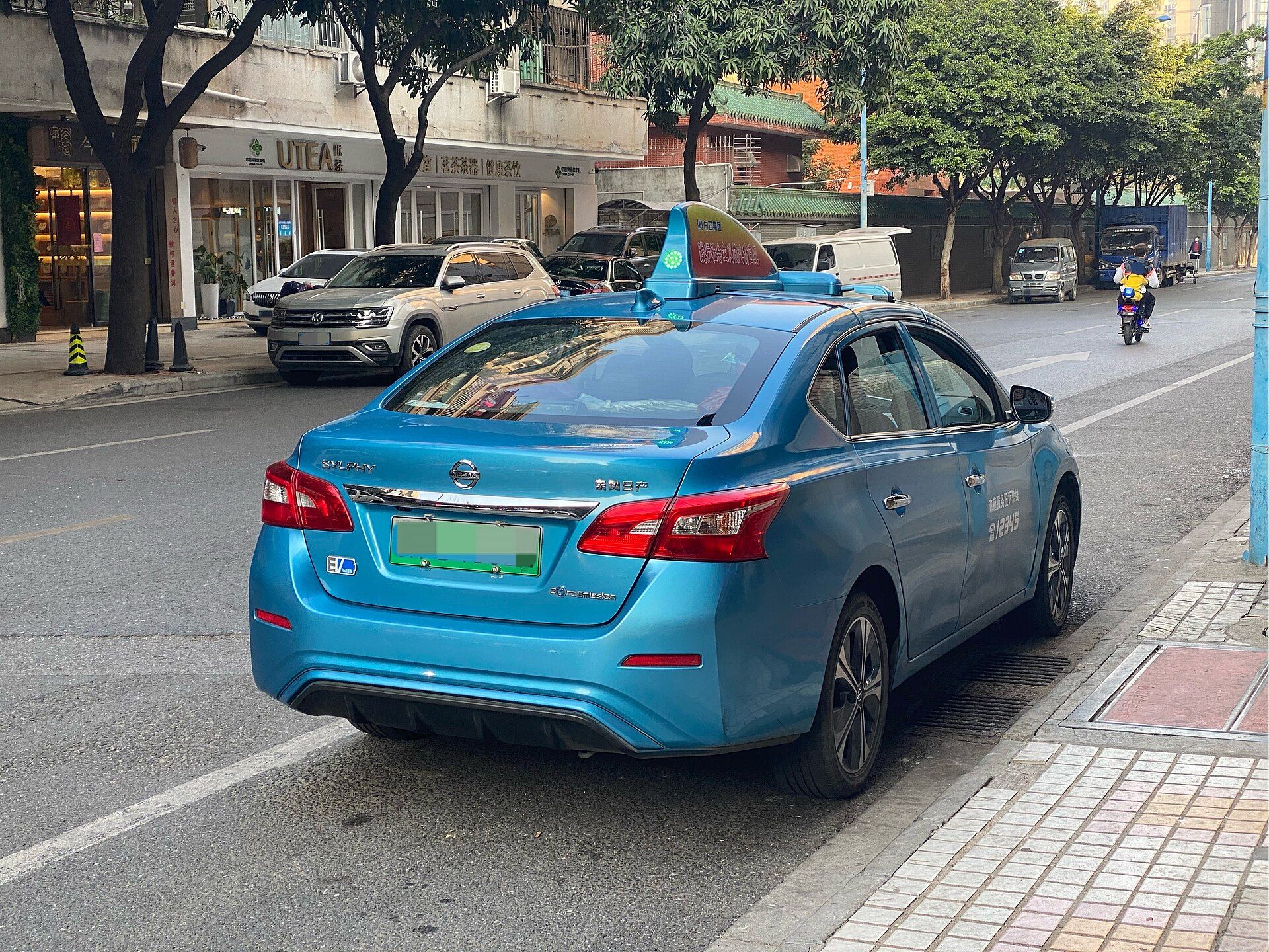 Electric taxi parked on a Guangzhou street