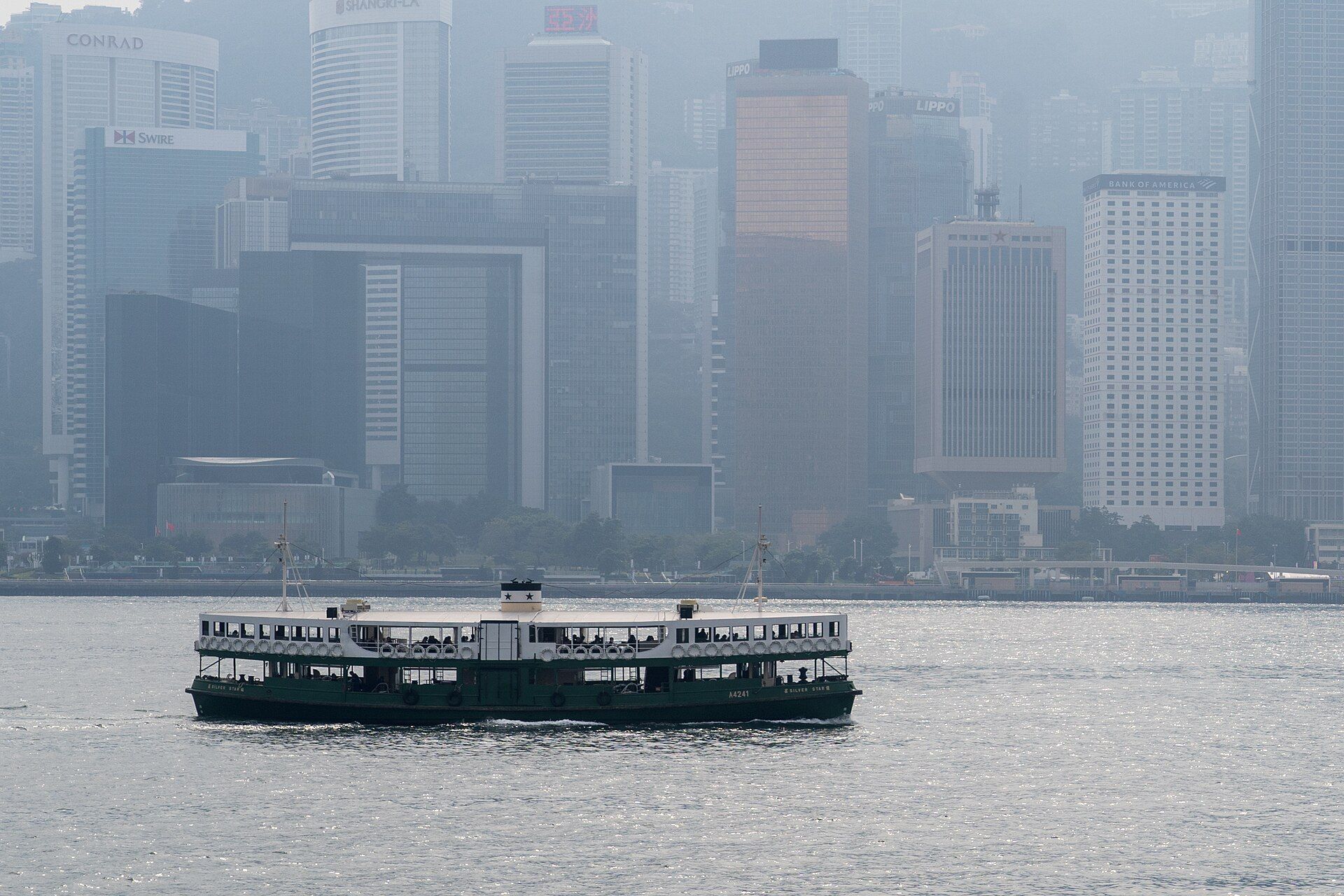 A Star Ferry crossing Victoria Harbour, with the Central skyline behind