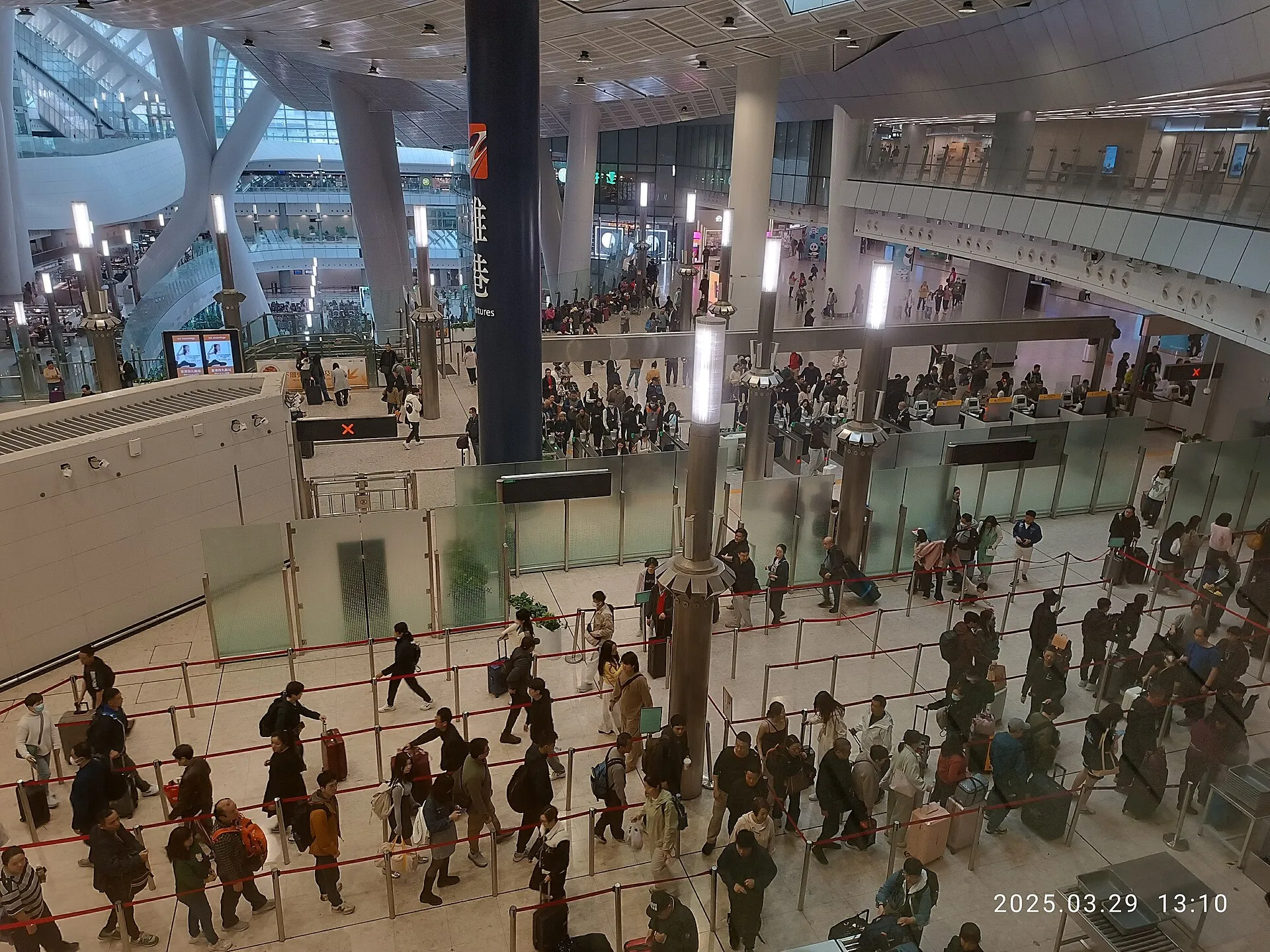Passengers queueing on Level B3 of West Kowloon Station